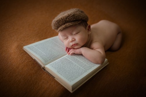 newborn-on-book